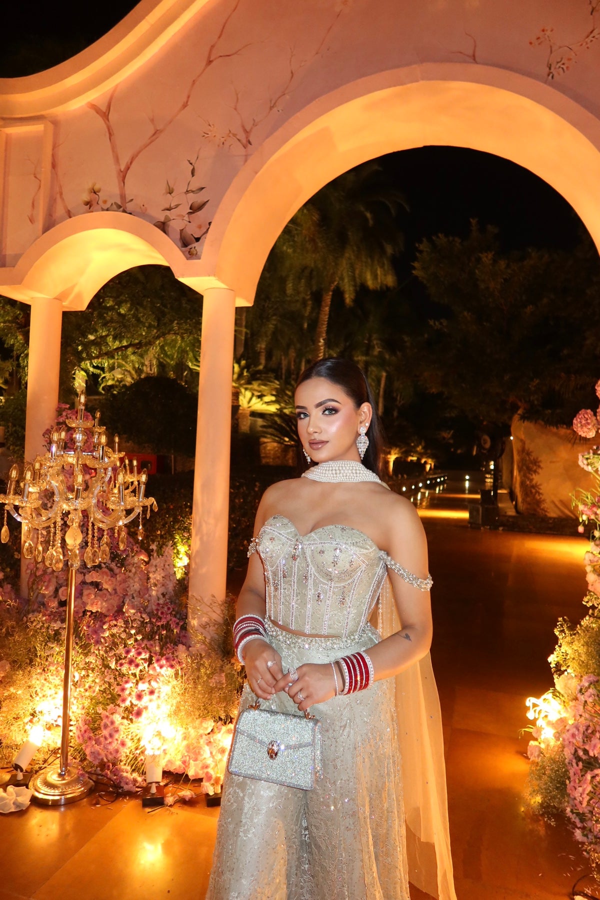 Sage green corset with off-shoulder straps and embroidered pants – front view